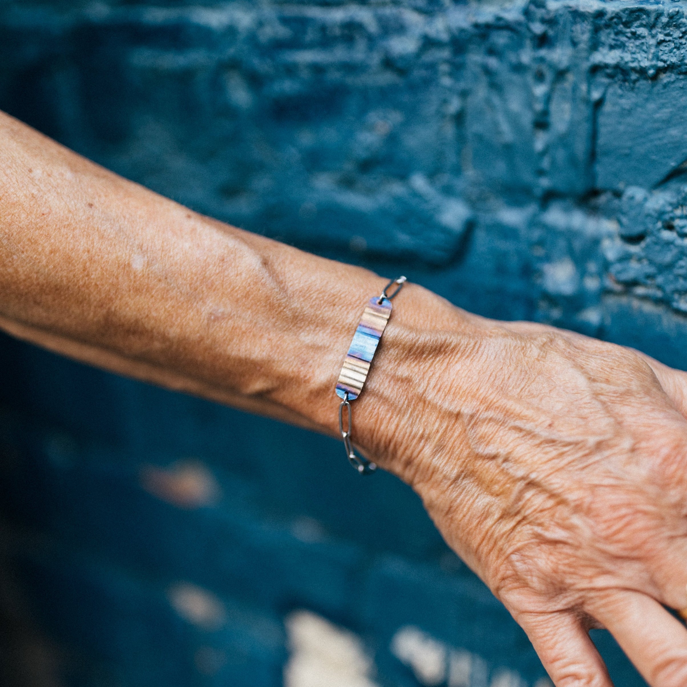 Ripple Effect Adjustable Bracelet | Fire Patina Steel Focal Point with Stainless Steel Paperclip Chain