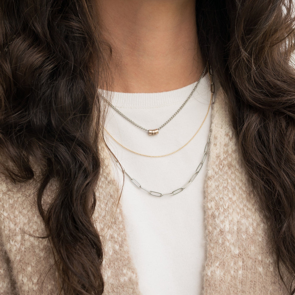 three strand necklace jacket long dark hair
