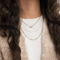 three strand necklace jacket long dark hair