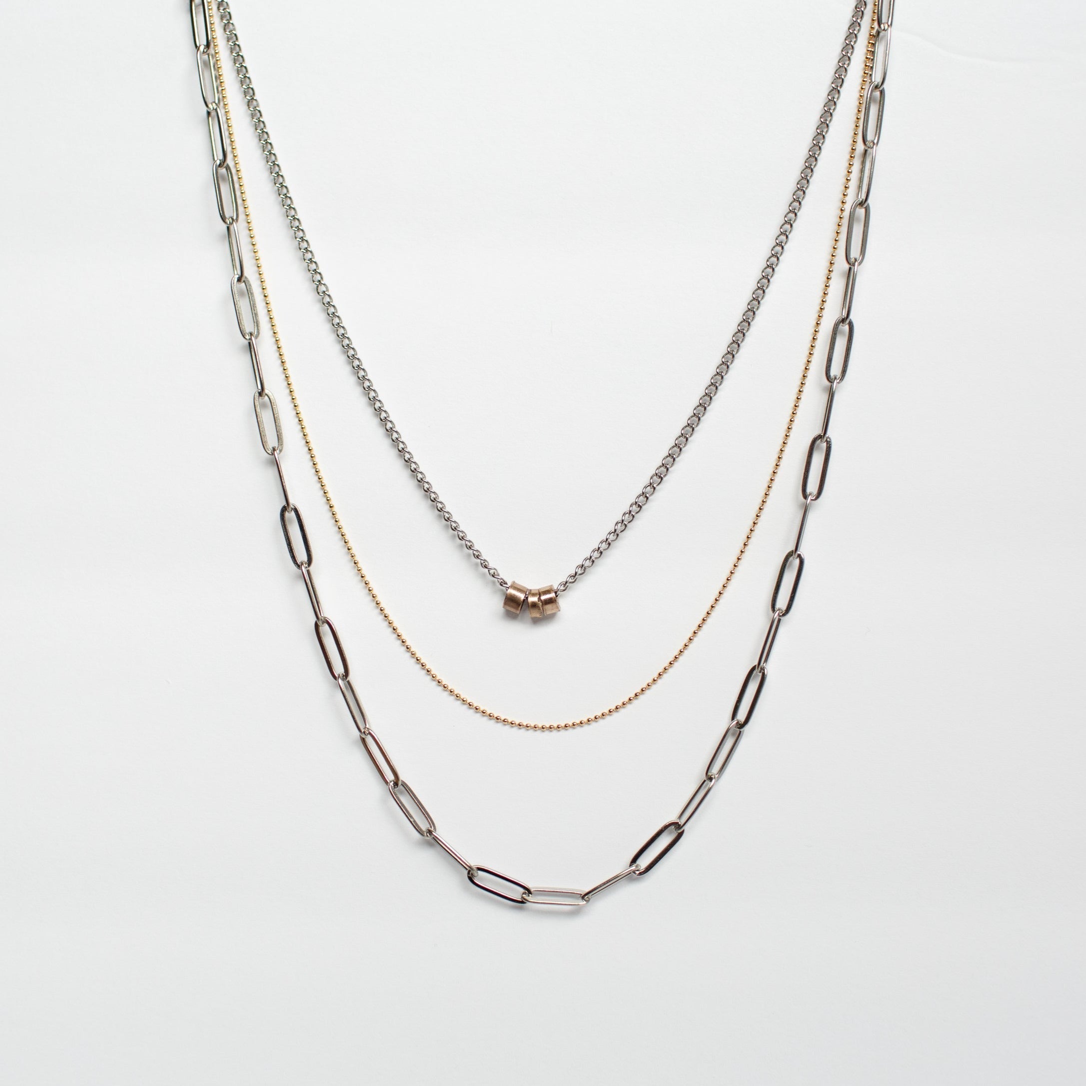 three strand necklace stainless steel brass copper against white background